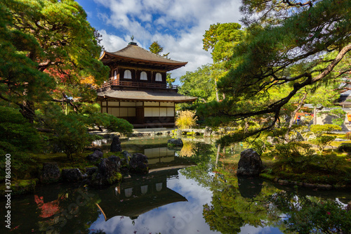 Temple surrounded of colored trees in Kyoto (Japan)