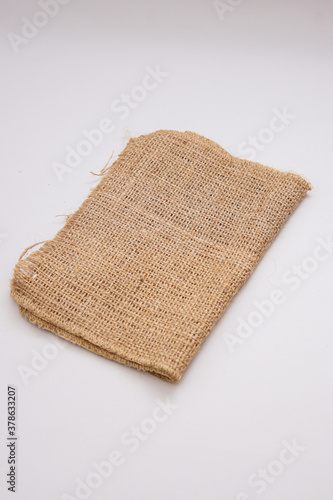 pieces of gunny sack against an isolated white background