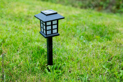 Photography Solar cell lamp in garden and save energy of electric and save my world,close up