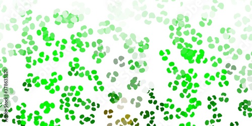 Light green, yellow vector backdrop with chaotic shapes.