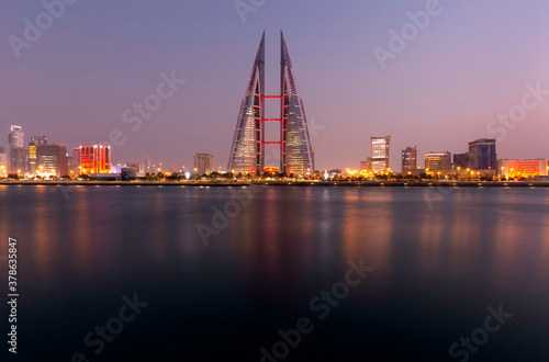 MANAMA, BAHRAIN - DECEMBER 19: The Bahrain World Trade Center at dusk, a twin tower complex is the first skyscraper in the world to have wind turbines, December 19, 2019 Manama, Bahrain © Dr Ajay Kumar Singh