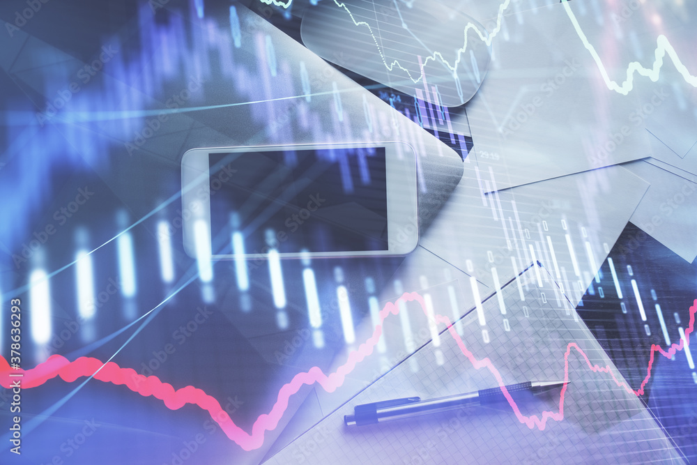 Multi exposure of forex graph hologram over desktop with phone. Top view. Mobile trade platform concept. Multi exposure of forex graph hologram over desktop with phone. Top view. Mobile trade platform concept.
