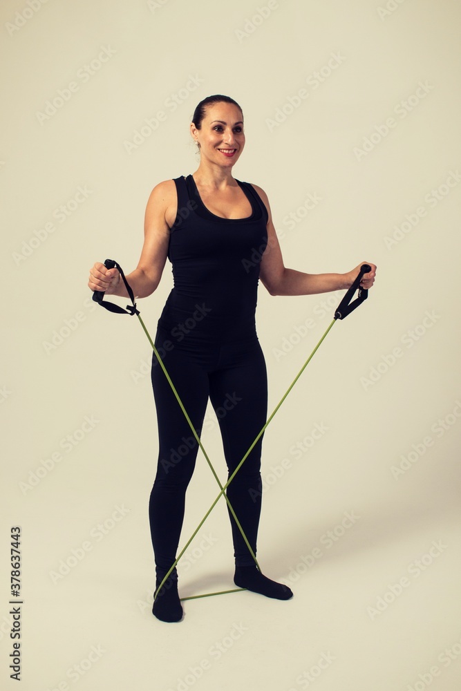 fitness woman with elastic bands doing shoulders two arms fitness woman with elastic bands doing shoulders two arms