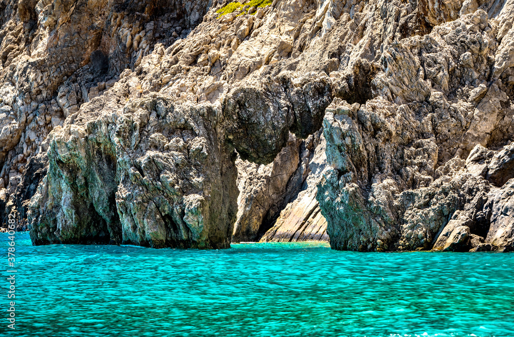 Rock cliff sea arch. Cretan seascape