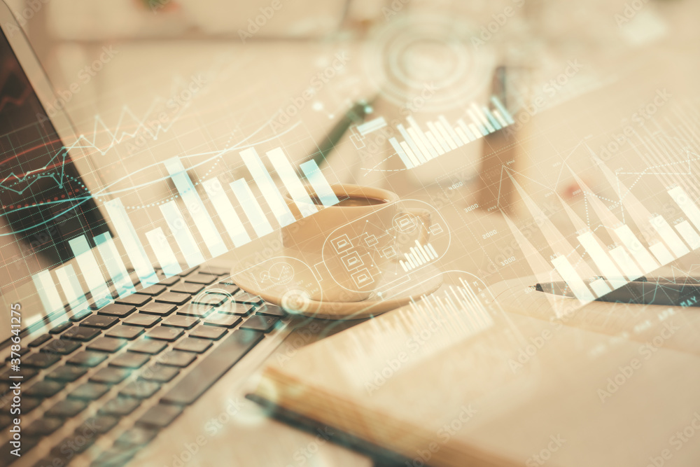Double exposure of financial chart drawing and desktop with coffee and items on table background. Concept of forex market trading Double exposure of financial chart drawing and desktop with coffee and items on table background. Concept of forex market trading
