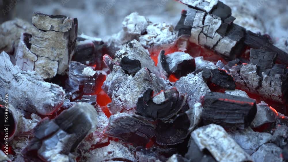 Coals burning for barbecue, smoldering and glowing in grill, for preparing meat grilled Coals burning for barbecue, smoldering and glowing in grill, for preparing meat grilled
