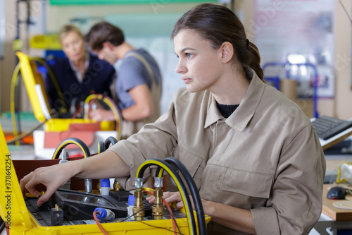Photography young people in technical vocational training with teacher