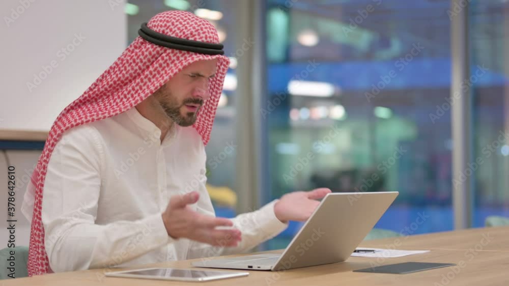Loss, Arab Businessman reacting to Failure on Laptop Loss, Arab Businessman reacting to Failure on Laptop