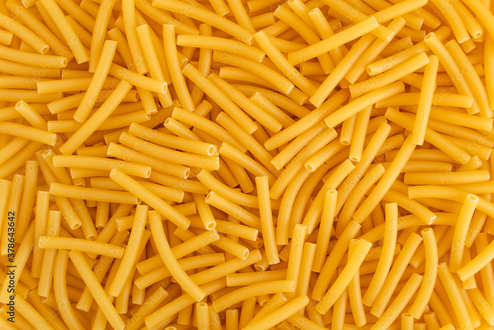 Raw dry uncooked Macaroni pasta spaghetti noodle on white bowl wooden background for basil tomato pesto sauce Homemade Italian food organic whole wheat vegan spaghetti for a healthy meal Raw dry uncooked Macaroni pasta spaghetti noodle on white bowl wooden background for basil tomato pesto sauce Homemade Italian food organic whole wheat vegan spaghetti for a healthy meal