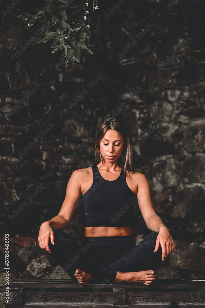 Blonde girl doing yoga in a deserted city. Playing sports at home during a pandemic Blonde girl doing yoga in a deserted city. Playing sports at home during a pandemic