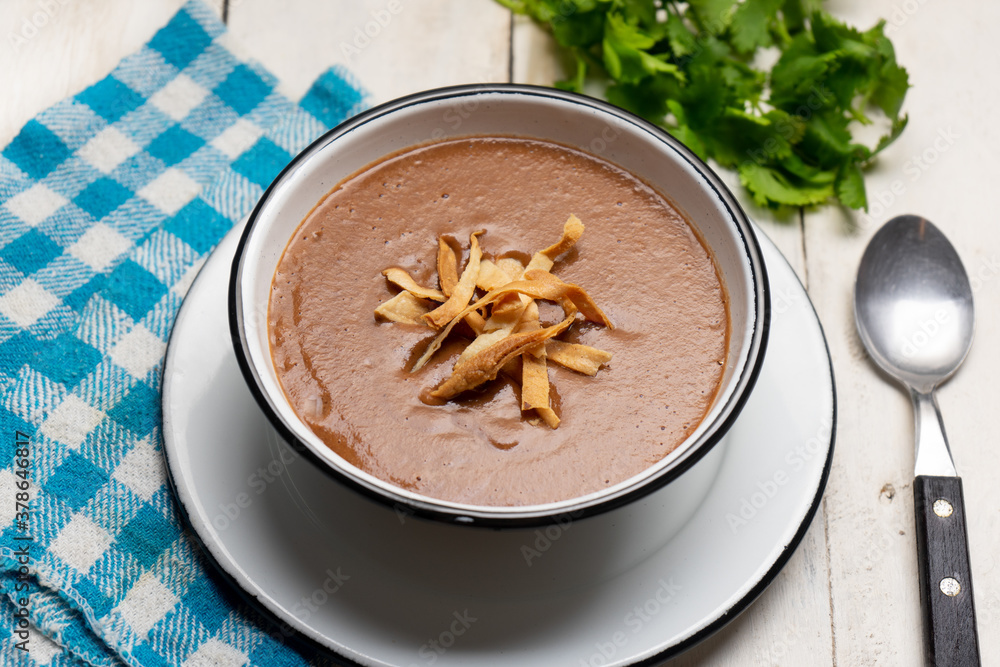 Mexican cream of bean soup on white background Mexican cream of bean soup on white background