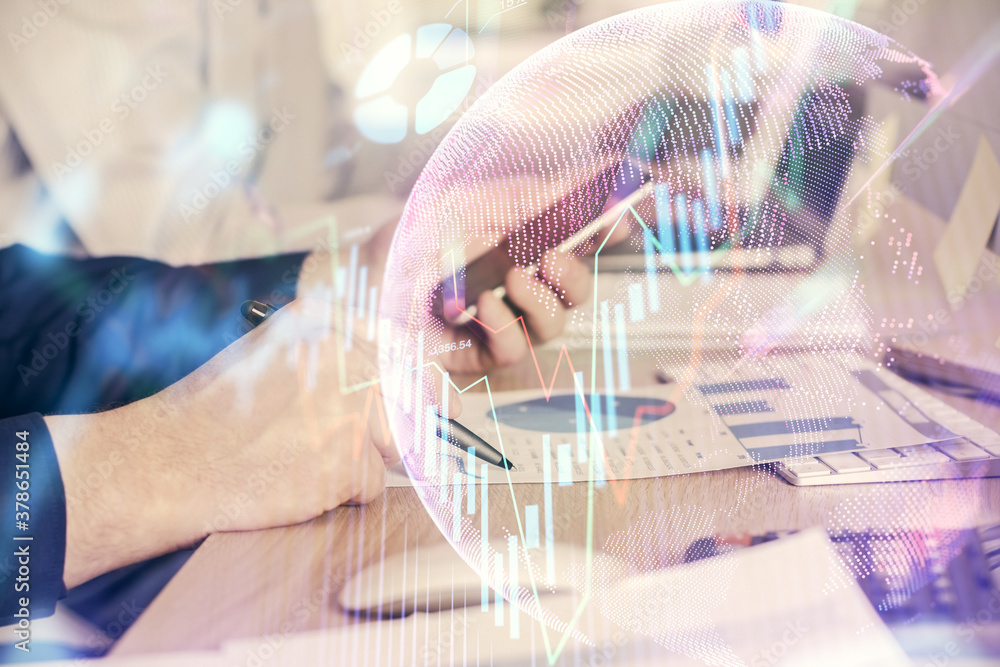 Double exposure of man's hands holding and using a digital device and forex graph drawing. Financial market concept. Double exposure of man's hands holding and using a digital device and forex graph drawing. Financial market concept.