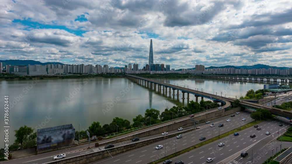 Time lapse. Seoul Subway with traffic and Seoul City Skyline showing tower in the financial district at Han river Seoul, South korea. Time lapse. Seoul Subway with traffic and Seoul City Skyline showing tower in the financial district at Han river Seoul, South korea.