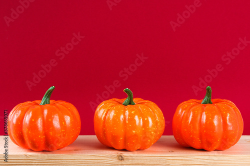 Halloween holiday concept with pumpkin decor on wooden table.