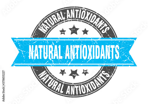 natural antioxidants round stamp with ribbon. label sign