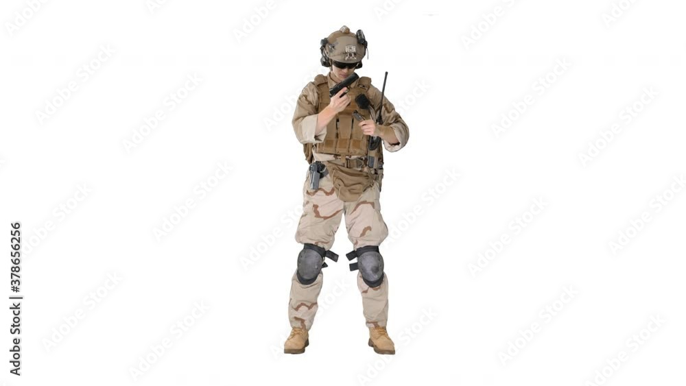 Marine in military uniform checking revolver gun on white background. Marine in military uniform checking revolver gun on white background.