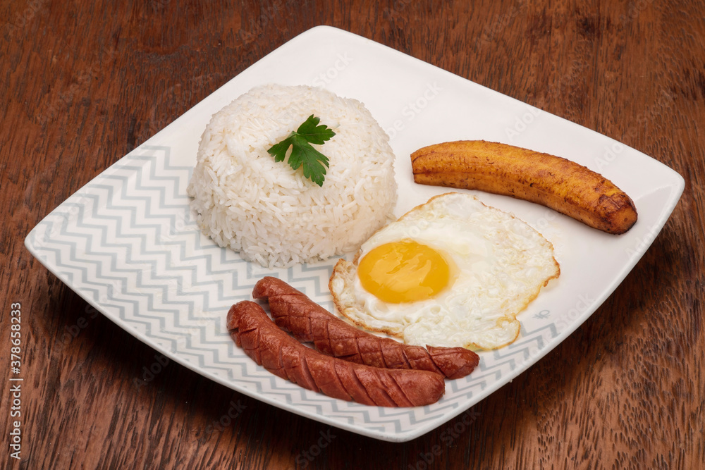 typical Brazilian dish, diced meat, rice, fried egg and fried banana