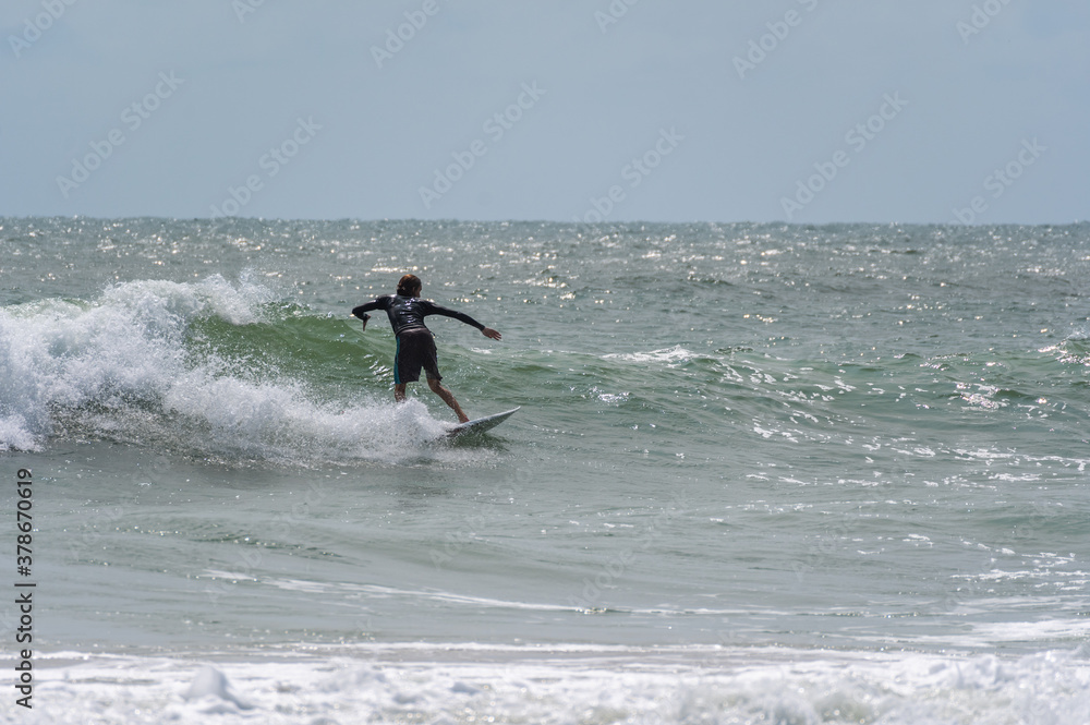 Surfer with back to shore