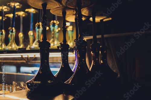 group of eastern hookahs on table close-up. photo