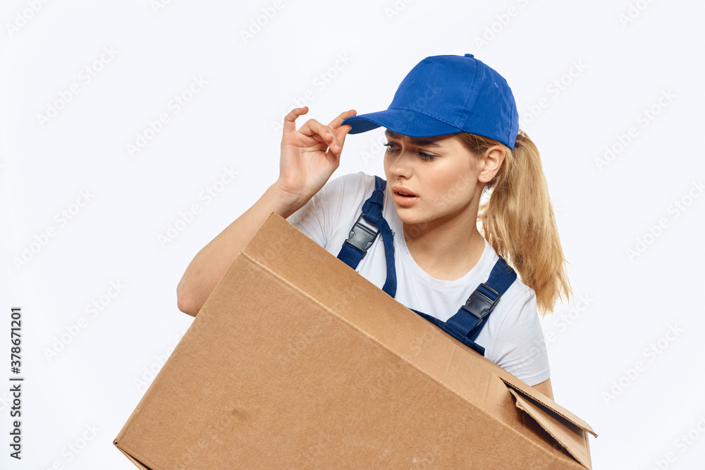 Woman working uniform box in hands packing service light background Woman working uniform box in hands packing service light background