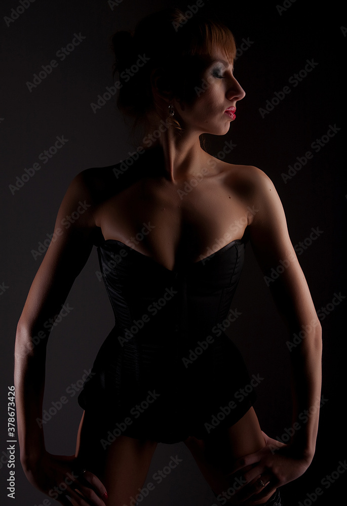 Naklejka premium Lingerie model over dark background