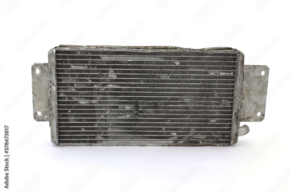 Fototapeta premium Old used car engine radiator on white background