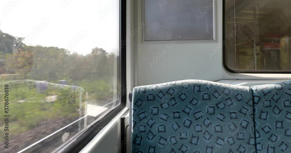 Interior view at train's empty window seat window move through countryside in Berlin, Germany. Window side view during commute and travel by Train. Interior view at train's empty window seat window move through countryside in Berlin, Germany. Window side view during commute and travel by Train.