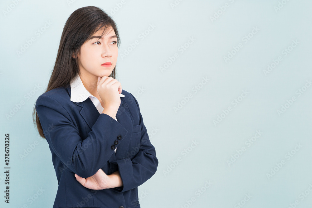 Teenage young girl wearing suit with hand on chin Teenage young girl wearing suit with hand on chin