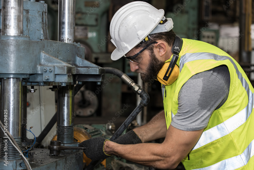 The technician is machine maintenance in the factory. The technician is machine maintenance in the factory.
