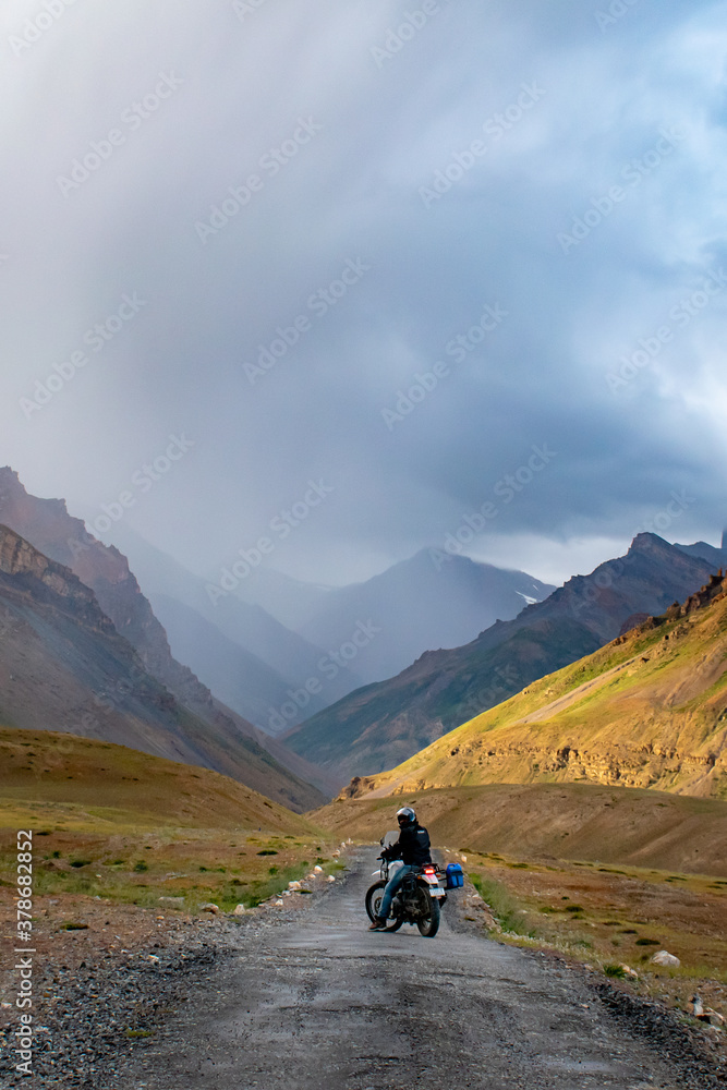 person riding a bike in mountains