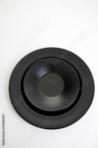 black plates on white background