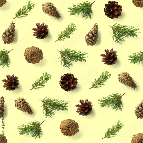 seamless christmas pattern from Pine cones on yellow background. modern pine cone christmas collage. Print for paper, fabric, wallpaper pinecones