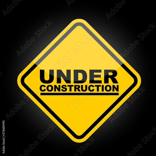 under construction sign on black