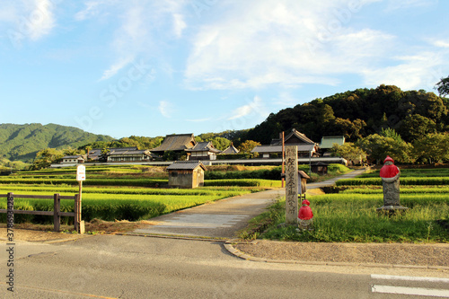Foto Village entrance sign and ricefield in Asuka