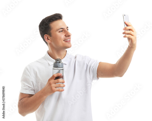 Young man with bottle of wa...