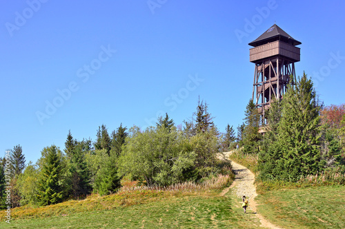 Lookout wooden tower for tourists on the top of the Luban peak in Gorce mountains, Poland