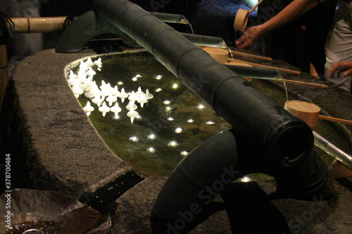 Floating candles inside the purification basin around Okadera Temple photo