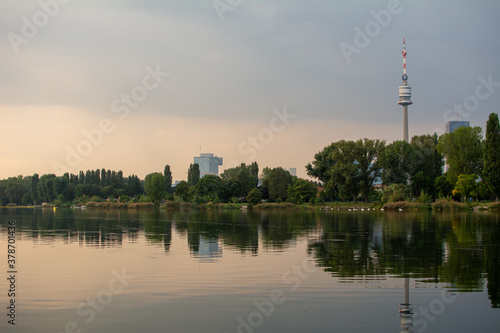 Autumn morning view at the recreation area Old Danube (Alte Donau) in Vienna, Austria. Tranquil scene with reflections on the Lake.
