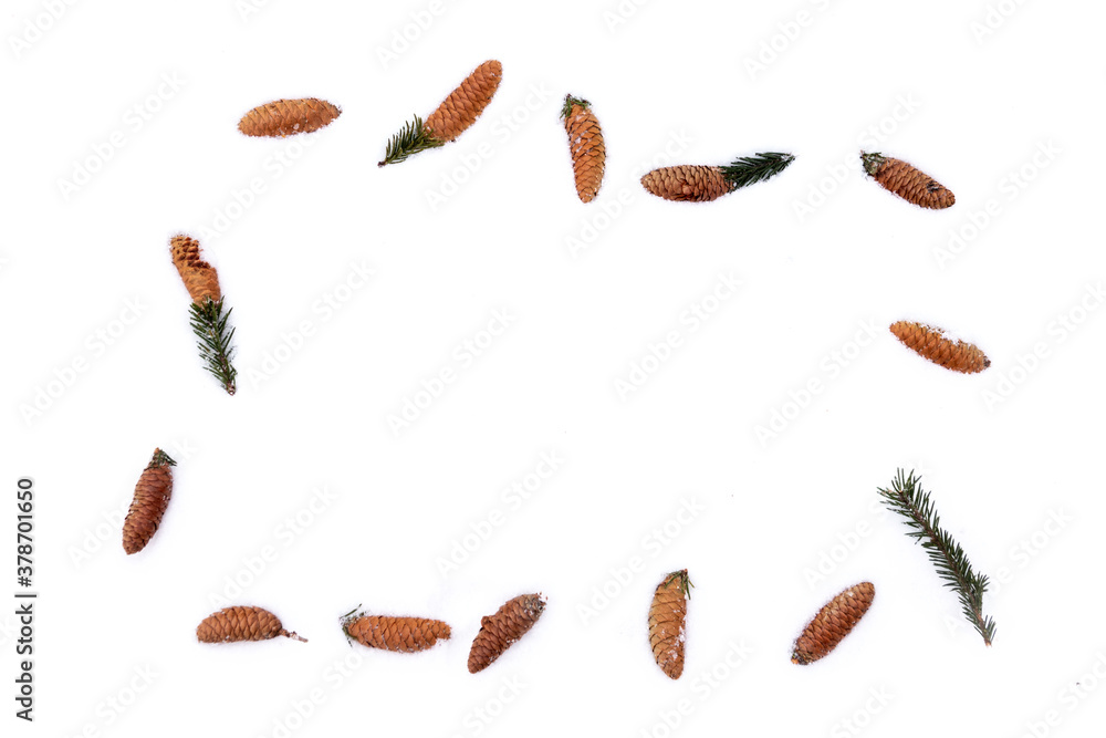 Frame of fir cones on white snow. Christmas framework with snow and cones Frame of fir cones on white snow. Christmas framework with snow and cones