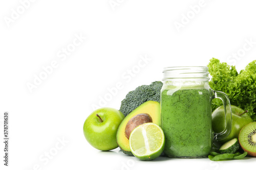 Green vegetables, fruits and jar of smoothie isolated on white background
