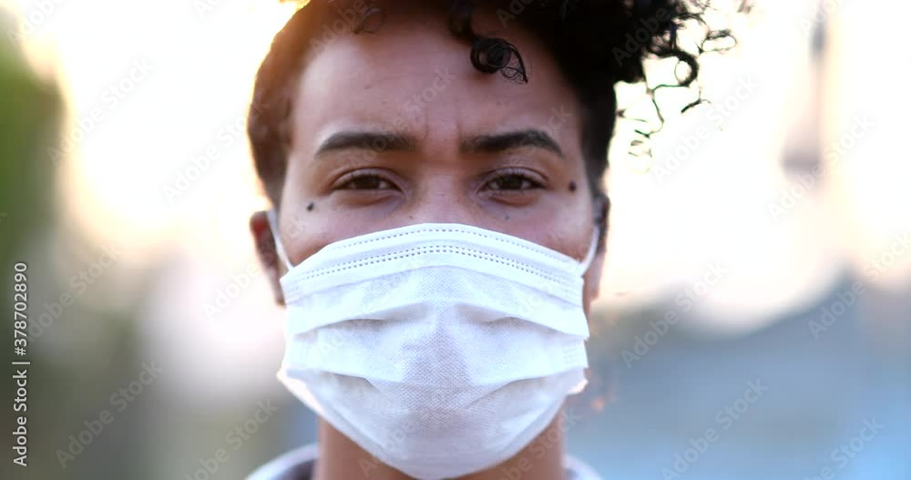 Black woman wearing covid-19 face mask outside Black woman wearing covid-19 face mask outside