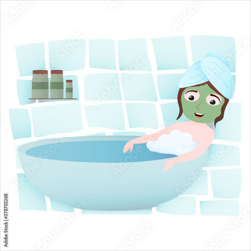 Little girl relaxing in bathtube, towel on head, applying cucumber mask on face, spa procedure, face care, hygiene routine