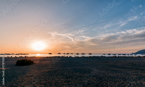 Beach umbrellas at sunrise