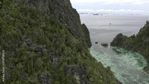 Raja Ampat, Misool, Palau Karawapop, Geosite, Love Lake Misool.  Aerial descending pan into lagoon.