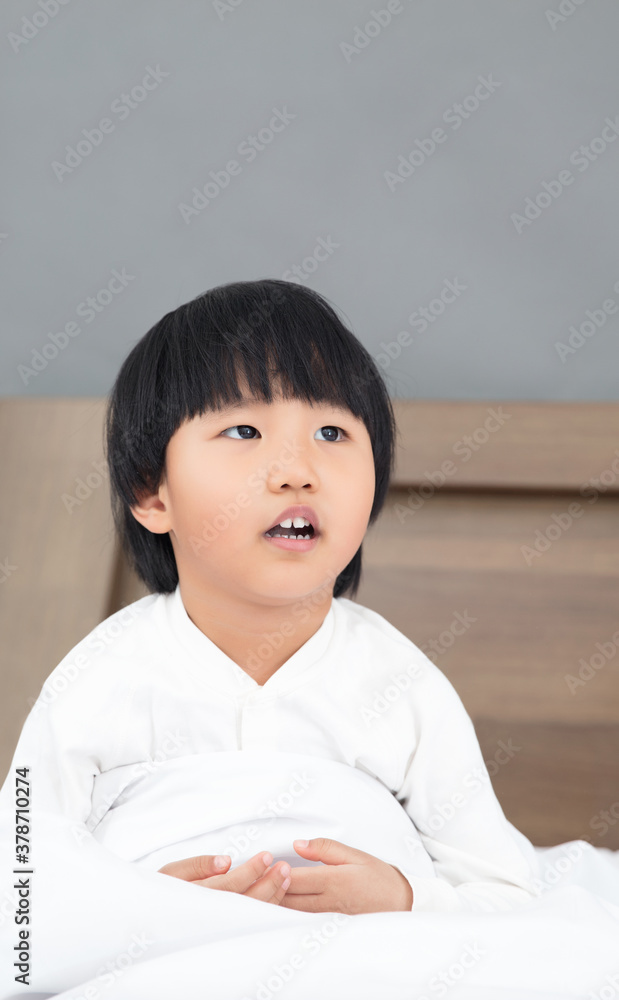 Child portrait sitting on the bed Child portrait sitting on the bed