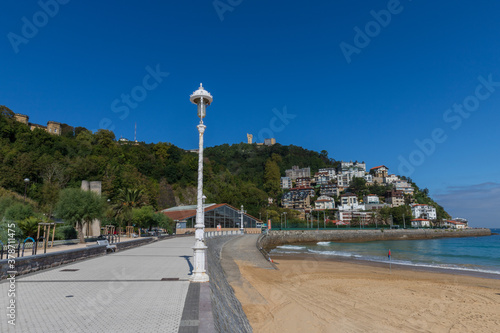 San Sebastian Ondarreta beach, La Concha bay. Mount Igueldo photo