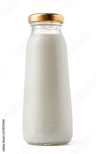 Closed glass milk bottle isolated on white background