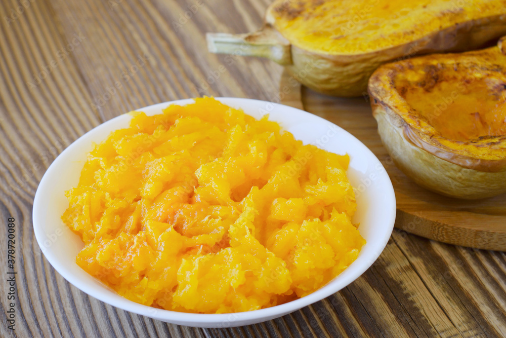Fresh homemade pumpkin puree in bowl. Baby food. Fresh, organic pureed vegetables. Fresh homemade pumpkin puree in bowl. Baby food. Fresh, organic pureed vegetables.