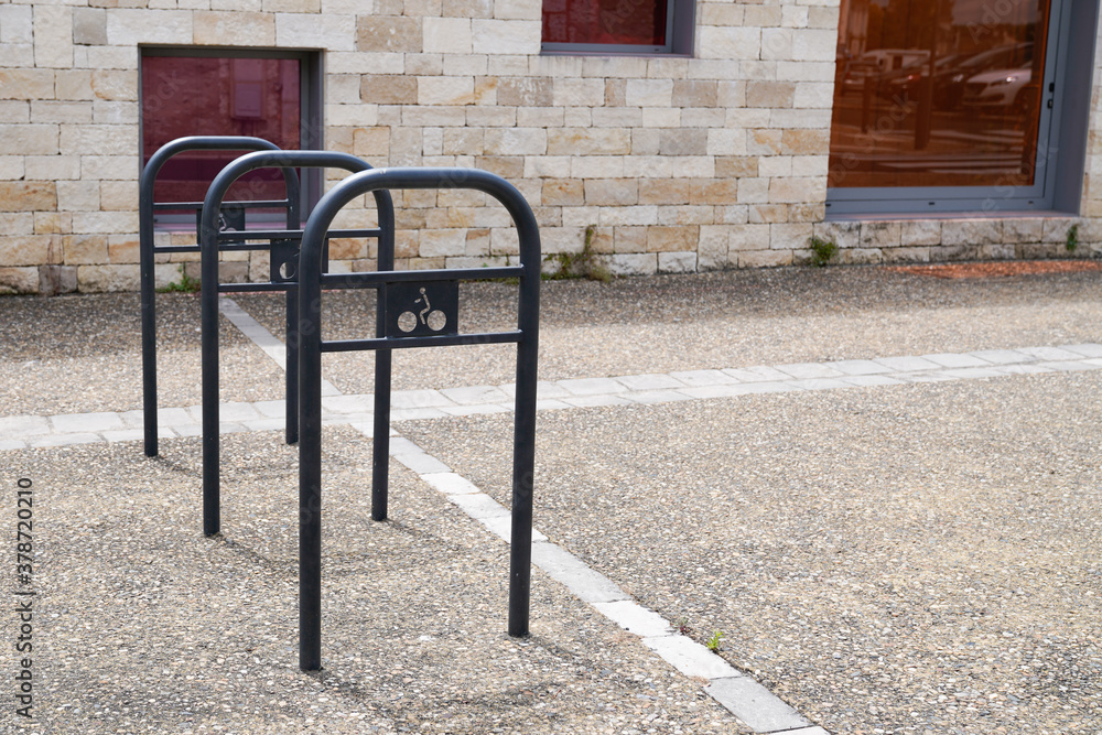 Metal bicycle parking lot in street city center for bike and motorbike Metal bicycle parking lot in street city center for bike and motorbike