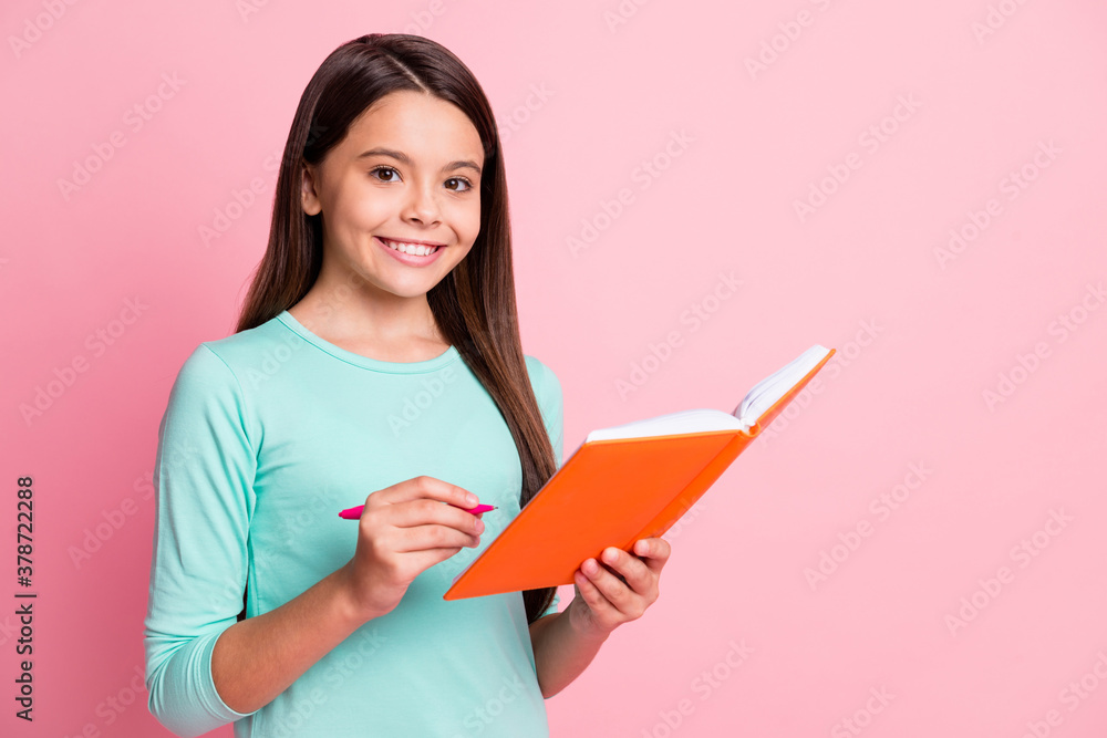 Photo of lovely cute little intelligent hispanic lady long hairstyle hands hold orange copybook pen write lesson white smile wear turquoise sweatshirt isolated pink color background Photo of lovely cute little intelligent hispanic lady long hairstyle hands hold orange copybook pen write lesson white smile wear turquoise sweatshirt isolated pink color background